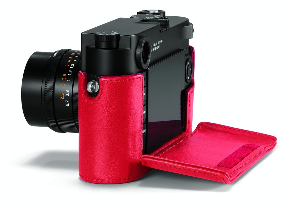 The flap assembly fits inside the case, under the camera. When the flap is removed there is a spacer accessory to maintain the camera at the same height inside the half-case. It